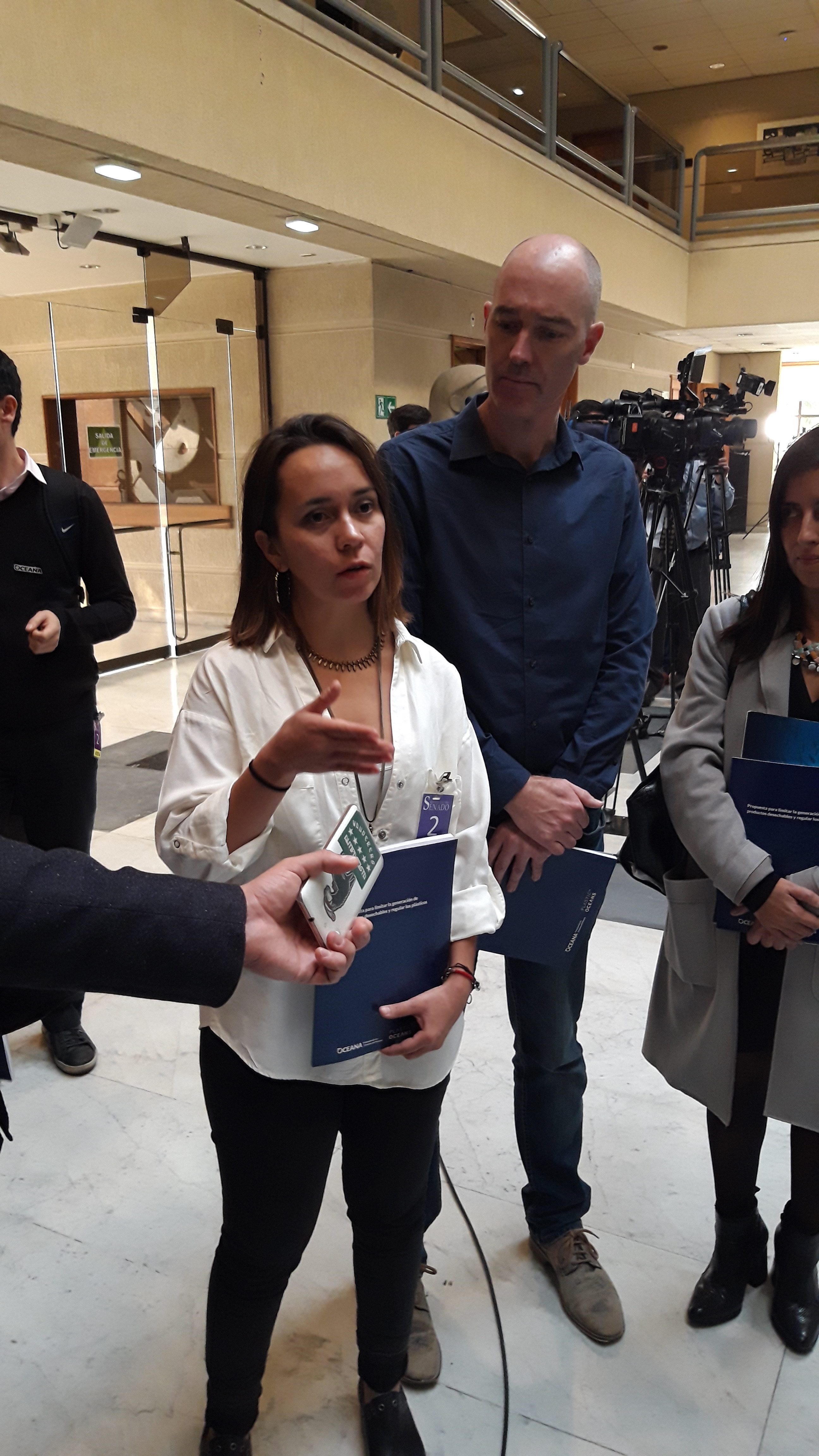 Science Director Camila Ahrendt explaining to the press how the environment is being affected by plastics