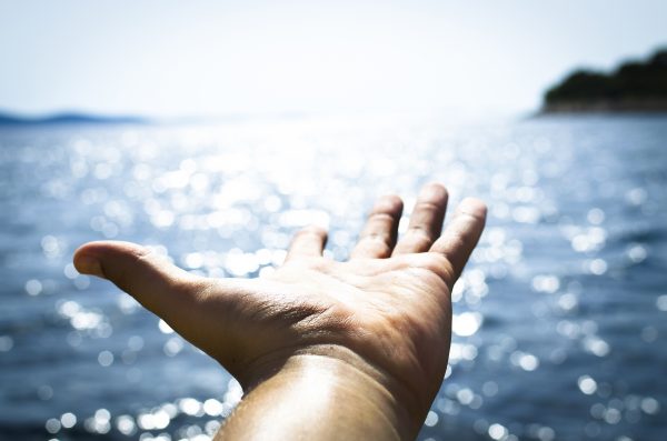 Man feeling freedom on open sea
