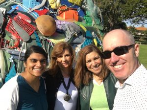 Executive Director Mark posing with people in front of plastic sculpture Cascais ambiente