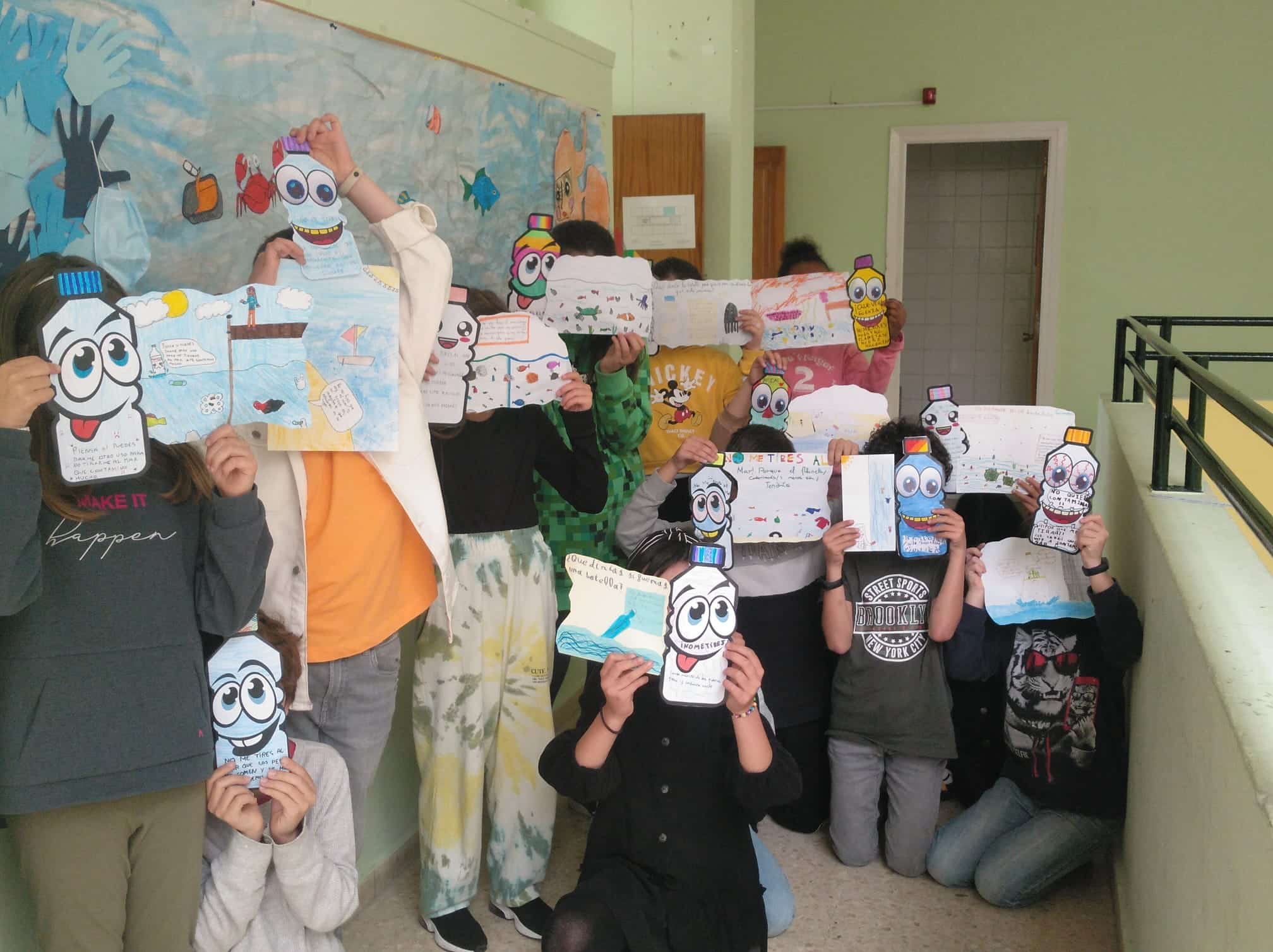 Kids display their Message of the Bottle projects.